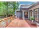 Open wooden back deck featuring a wooden railing, plants and an outdoor umbrella at 2981 Cardinal Lake Dr, Duluth, GA 30096