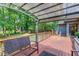 Wooden back deck with modern railings, outdoor seating, and shade canopy at 2981 Cardinal Lake Dr, Duluth, GA 30096