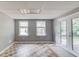Finished basement with tile flooring, two windows, and access to the backyard at 2981 Cardinal Lake Dr, Duluth, GA 30096