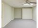 Finished basement featuring neutral paint, carpet, ceiling fan, and sliding door closet for ample storage at 2981 Cardinal Lake Dr, Duluth, GA 30096