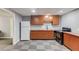 Basement kitchenette featuring a refrigerator, a sink, cabinets and black appliances at 2981 Cardinal Lake Dr, Duluth, GA 30096