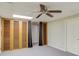 Finished basement with neutral paint, carpet, ceiling fan, closet and doorway with curtains at 2981 Cardinal Lake Dr, Duluth, GA 30096
