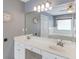 Bright bathroom featuring double sinks, large mirror, and soaking tub in background at 2981 Cardinal Lake Dr, Duluth, GA 30096