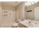 Clean bathroom with tub-shower combo, white fixtures, and single sink vanity at 2981 Cardinal Lake Dr, Duluth, GA 30096