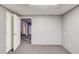 Neutral bedroom featuring gray walls, access to the kitchen, and an open double door at 2981 Cardinal Lake Dr, Duluth, GA 30096