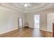 Bright bedroom with hardwood floors, trey ceiling, ceiling fan, and ensuite bath access at 2981 Cardinal Lake Dr, Duluth, GA 30096