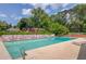 Community pool featuring lounge chairs, blue water, and lush landscaping in the background at 2981 Cardinal Lake Dr, Duluth, GA 30096