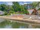 Lakeside view with a sitting area, the name of the lake, and the shoreline at 2981 Cardinal Lake Dr, Duluth, GA 30096