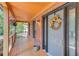 Close-up of the front door with a decorative wreath, sidelights, and a covered porch at 2981 Cardinal Lake Dr, Duluth, GA 30096