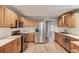 Bright, modern kitchen with stainless steel appliances and light wood cabinetry at 2981 Cardinal Lake Dr, Duluth, GA 30096