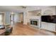 Inviting living area featuring a fireplace with built-in shelving and luxury vinyl plank flooring at 2981 Cardinal Lake Dr, Duluth, GA 30096