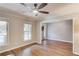 Light and bright living room with crown molding, luxury vinyl floors, and a ceiling fan at 2981 Cardinal Lake Dr, Duluth, GA 30096