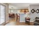 Open concept living space featuring dining area and breakfast bar with kitchen view at 2981 Cardinal Lake Dr, Duluth, GA 30096