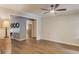 Spacious living room with crown molding, view into the kitchen, and luxury vinyl flooring at 2981 Cardinal Lake Dr, Duluth, GA 30096