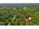 Aerial view of the surrounding area, showcasing green trees, and distant buildings at 3925 Rock Mill Pkwy, Marietta, GA 30062