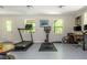 Finished basement area featuring home gym with exterior access and dedicated office area at 3925 Rock Mill Pkwy, Marietta, GA 30062