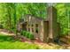 Beautiful exterior view of a home with ample windows, a chimney, and well-maintained landscaping at 3925 Rock Mill Pkwy, Marietta, GA 30062
