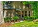 Charming home exterior featuring well-maintained landscaping, a cozy front porch, and neutral-toned siding at 3925 Rock Mill Pkwy, Marietta, GA 30062