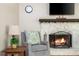 Cozy living room with a stone fireplace, comfortable seating, and a mounted television at 3925 Rock Mill Pkwy, Marietta, GA 30062