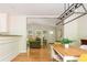 Open living space with hardwood floors, modern lighting and furniture, and a view of the kitchen at 3925 Rock Mill Pkwy, Marietta, GA 30062