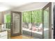 View of an outdoor wooden patio with chairs from inside the house at 3925 Rock Mill Pkwy, Marietta, GA 30062