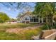 A sprawling yard is overlooked by the home and a sunroom addition; a great place for relaxing and recreation at 317 Ellenwood Dr, Bowdon, GA 30108