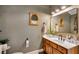 Updated bathroom with wood paneling, modern vanity and an oversized mirror at 317 Ellenwood Dr, Bowdon, GA 30108