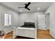 Bright bedroom with hardwood floors and ample natural light from the shuttered window at 317 Ellenwood Dr, Bowdon, GA 30108