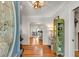 Warm and inviting foyer with hardwood floors and a glimpse into the open dining space at 317 Ellenwood Dr, Bowdon, GA 30108