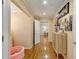 Hallway with hardwood flooring, leading to other rooms, offering both style and functionality at 317 Ellenwood Dr, Bowdon, GA 30108