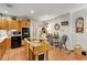 Rustic kitchen with tile floors, butcher block island, and oak cabinets at 317 Ellenwood Dr, Bowdon, GA 30108