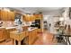 Open concept kitchen featuring an island, tile floors, and wood cabinetry at 317 Ellenwood Dr, Bowdon, GA 30108