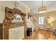 Cozy living room showcasing a vintage mantel and bright hardwood flooring at 317 Ellenwood Dr, Bowdon, GA 30108
