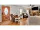 Cozy living room featuring hardwood floors, comfortable seating, and a decorative fireplace at 317 Ellenwood Dr, Bowdon, GA 30108