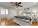 Bright bedroom features hardwood floors and ample natural light from a large window at 317 Ellenwood Dr, Bowdon, GA 30108