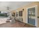 Inviting front porch with brick flooring, seating, and stylish decor for a welcoming entry at 317 Ellenwood Dr, Bowdon, GA 30108