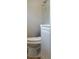 A half-bathroom with a white vanity and toilet at 3833 Coral Ln, Douglasville, GA 30135