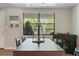 Bright dining room featuring a decorative lantern, dark table, and a large window at 3833 Coral Ln, Douglasville, GA 30135