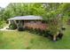 Charming brick home featuring a well-maintained lawn and lovely landscaping at 3833 Coral Ln, Douglasville, GA 30135