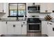 Modern kitchen showcasing granite countertops and stainless steel oven range at 3833 Coral Ln, Douglasville, GA 30135