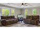 Cozy living room with wood-look flooring, neutral colors, and a view of the outdoors at 3833 Coral Ln, Douglasville, GA 30135