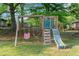 Charming backyard playground featuring a swing set, slide, and climbing structure for Gathering fun and recreation at 3833 Coral Ln, Douglasville, GA 30135
