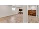 Finished basement with wood-look floors, a piano, and a TV area at 3990 Admiral Dr, Chamblee, GA 30341