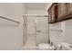 Well-lit bathroom featuring a glass-enclosed shower, bidet, and convenient towel racks at 3990 Admiral Dr, Chamblee, GA 30341