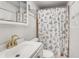 Cozy bathroom with a decorative shower curtain, updated vanity, and ample lighting at 3990 Admiral Dr, Chamblee, GA 30341