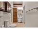 Well-lit bathroom featuring a toilet, sink, and wooden storage cabinet at 3990 Admiral Dr, Chamblee, GA 30341