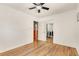Bedroom featuring hardwood floors, open closet, and ensuite access at 3990 Admiral Dr, Chamblee, GA 30341