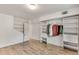 Bedroom with new hardwood floors, closet, and ceiling light at 3990 Admiral Dr, Chamblee, GA 30341