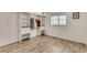 Bedroom with laminate floors, bright window, and a built-in closet system at 3990 Admiral Dr, Chamblee, GA 30341