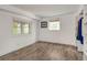 Bedroom with modern laminate floors, bright windows, and a built-in closet system at 3990 Admiral Dr, Chamblee, GA 30341